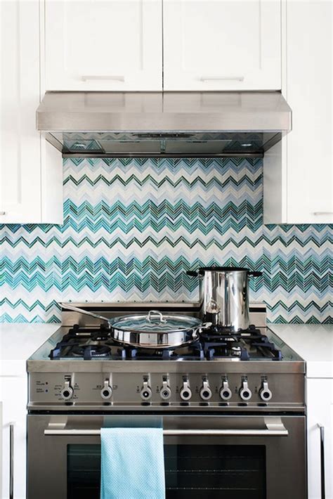 Turquoise kitchen features a beadboard ceiling lined with a pair of sloane single pendants illuminating center island lined with turquoise counter stools situated across from white shaker cabinets paired with white quartz countertops and a white and turquoise blue mosaic glass tiled backsplash which frame windows dressed in light gray sheer cafe curtains. Turquoise Backsplash - Contemporary - kitchen - Jute ...