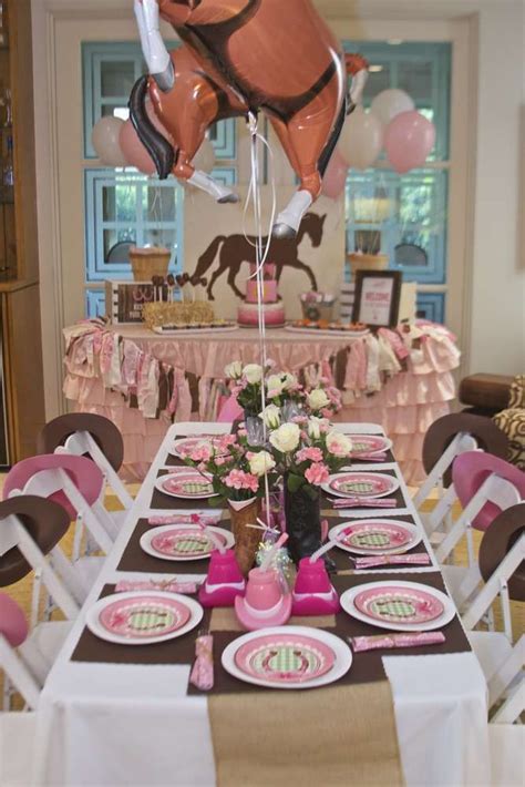 Decorated table at a cowgirl birthday party! See more party ideas at