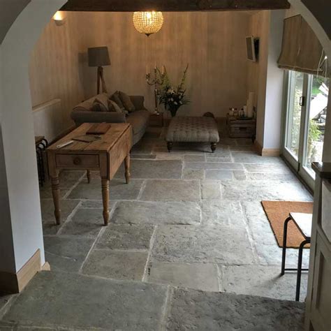 They cost similar to other flooring materials. Reclaimed antique English Yorkstone flooring | Natural Stone Consulting