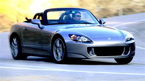 Its cockpit is best described as snug, but the sports seats are well designed to make long journeys comfortable. Best All-Around Sports Car: Honda S2000