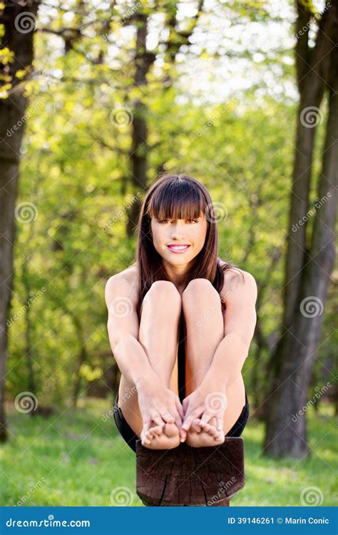 barefoot woman sitting on bench in park stock image image of girl leisure 39146261