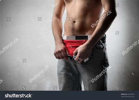Man Taking Off His Pants Foto Stock Shutterstock