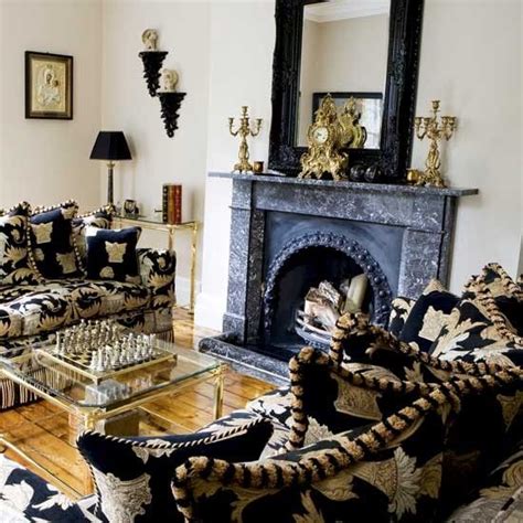 Statement Sofas And A Dark Marble Fireplace Create An Opulent Feel
