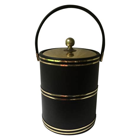 A fantastic addition to your mid century bar! Faux Leather & Gold Ice Bucket | Chairish