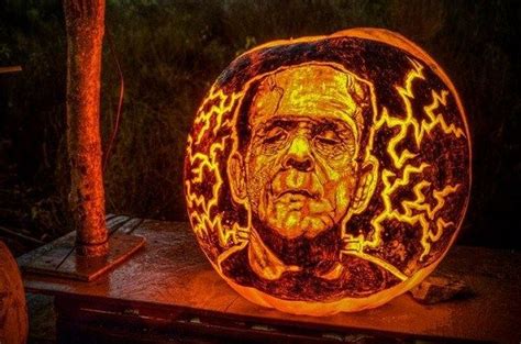 A Carved Pumpkin With An Image Of Abraham Lincoln On Its Face Is Lit Up