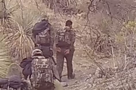 Alleged Armed Smugglers Caught On Arizona Border Trail Camera Escorting