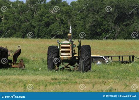 An Antique Oliver Far Tractor In A Farm Field With Grass Editorial
