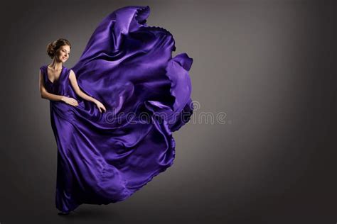 Woman Purple Dress Fashion Model In Long Silk Gown Waving Cloth On