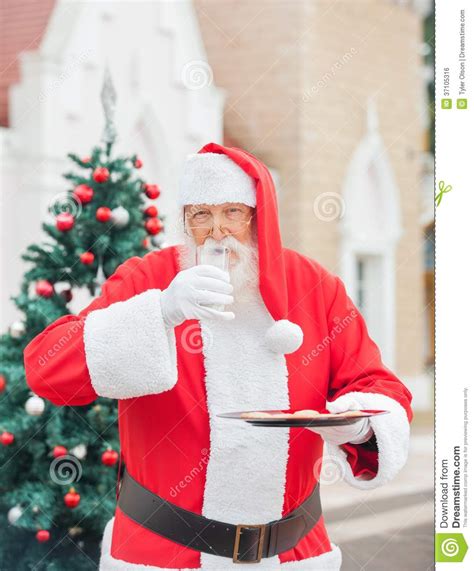 Santa Claus With Cookies Drinking Milk Stock Photo Image