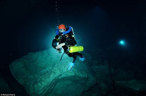 Spectacular Images Of Divers Exploring Water Filled Cavern Hidden