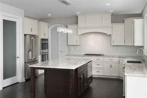 With its noble materials, stunning finishes, and rich textures, cabico is elegance incarnate. Arched openings, white cabinets, satin etched glass pantry door and a stained island are the ...