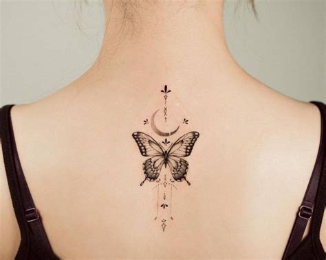Fine Line Ornamental Butterfly Tattoo On The Upper