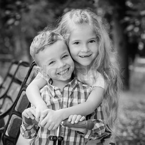 The Older Sister Hugs Her Younger Brother Stock Image Colourbox