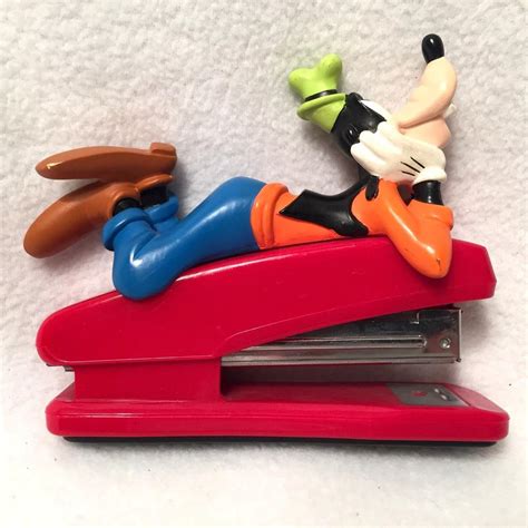 Vintage Goofy Laying Down On Top Of Red Stapler Walt Disney 1933237583