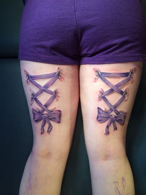 Purple Corset Bow Tattoo On Back Both Thighs  750×1000 Leg Tattoos Tattoos Thigh
