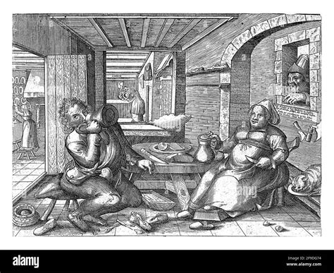 un zapatero y una mujer están sentados en una habitación en una mesa redonda baja bebiendo
