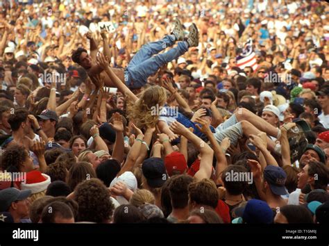 Concert Fans Are Shown Being Passed Around The Crowd During Woodstock
