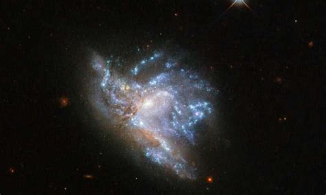 Hubbles Dazzling Display Of Two Colliding Galaxies Nexus Newsfeed
