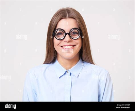 Studio Portrait Of Funny Happy Young Business Woman In Big Nerd
