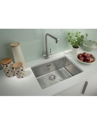 A finished kitchen with white cabinets and pink granite countertops. Square, Modern single bowl undermount. 1.2mm this ...