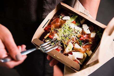 It'll also encourage you to establish and work towards realistic milestones that will help your business to grow. Womans Hand Is Holding A Take Away Fresh Salad In A Lunch ...