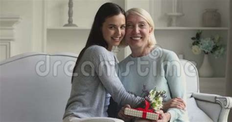 Happy Young Adult Daughter Congratulating Mature Mum With Mothers Day Stock Footage Video Of