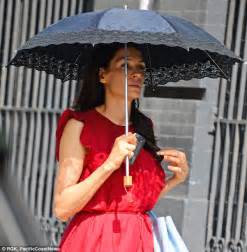 Famke Janssen Shields Her Youthful Skin With A Frilly Sunbrella As