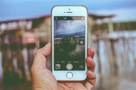 Person Holding Smartphone Showing Camera Application · Free Stock Photo