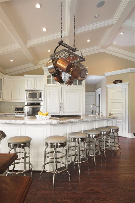 Wooden beam work not only covers up evidence of cracked drywall and plaster, but enhances the space with. Pot rack hung from vaulted ceiling | Vaulted ceiling ...