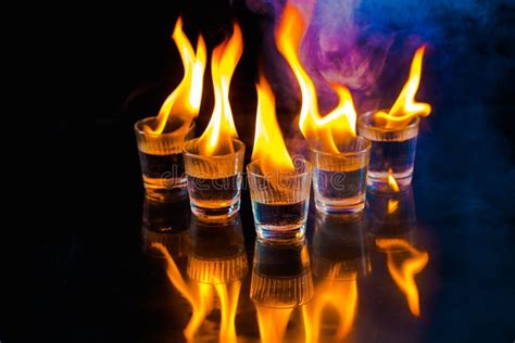 Glasses With Burning Alcohol On Black Background Stock Photo Image Of
