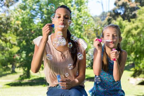 Daughter Blowing Bubbles Mother Stock Photos Free Royalty