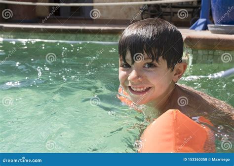 Boy Wearing Arm Floaties In A Swimming Pool Stock Photo Image Of