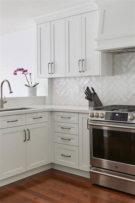 Their color matches well with the white cabinets. 50+ White Herringbone Backsplash ( Tile in Style ...