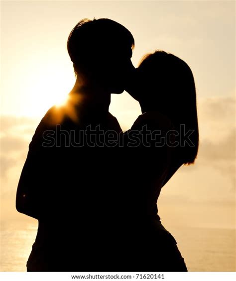 Couple Kissing Sunrise Beach Stock Photo Edit Now 71620141