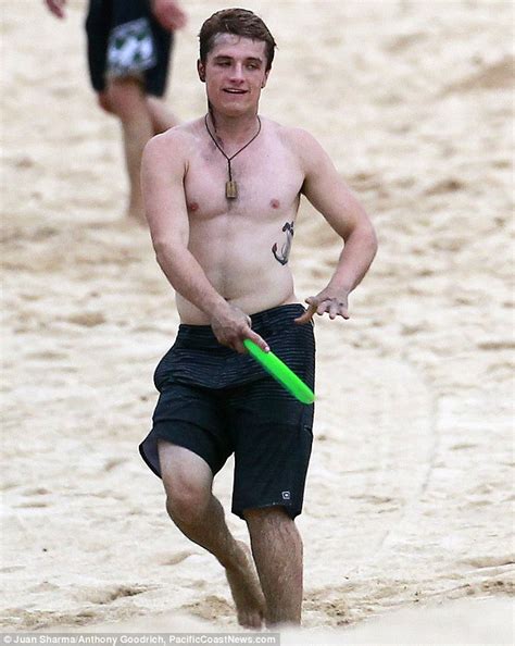 the hunger games shirtless josh hutcherson plays frisbee and dives into the ocean as he takes a