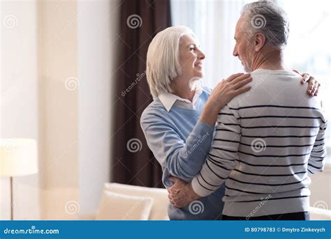 Cheerful Aged Couple Hugging Each Other At Home Stock Image Image Of Modern Interaction 80798783