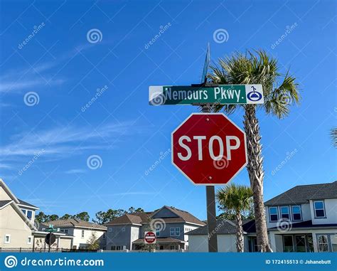 A Sign That Says Stop On A Street Corner In Laureate Park Editorial