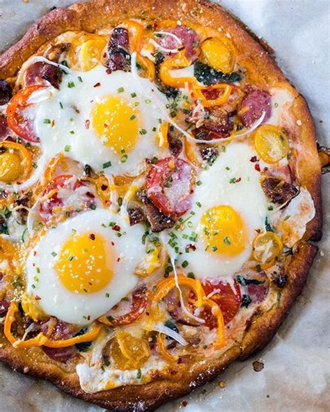 Breakfast Pizza Topped With Eggs Sausage Cheese Bacon And Yellow