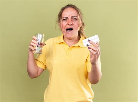 Free Photo Unhealthy Woman In Yellow Shirt Feeling Terrible Holding