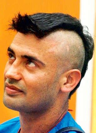 Very short mens haircut where hairs clipped high from the back and with dense hairs in the crown area. Dhoni starts a Mohawk trend! Hair-raising style sweeps ...