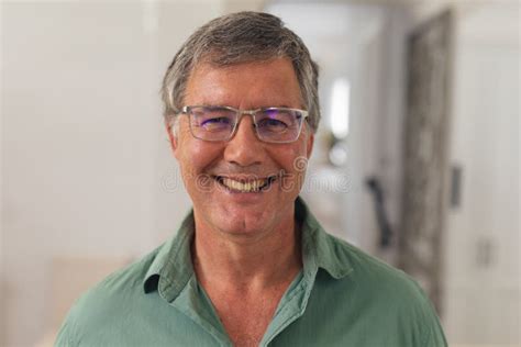 Close Up Portrait Of Happy Caucasian Senior Man In Eyeglasses At Home