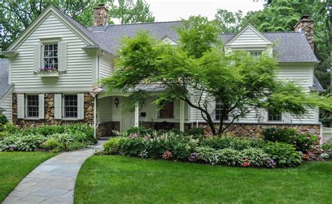 Landscaping raised ranch style homes can be a challenge, with their long, exposed exterior fronts and bare vertical lines. Ornamental Plantings 1 - CLC Landscape Design | Landscape ...