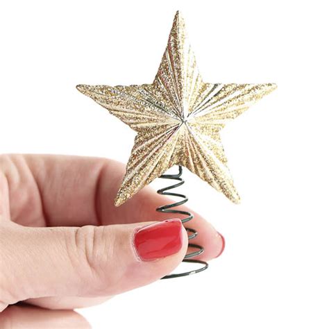 Miniature gold metallic star tree topper