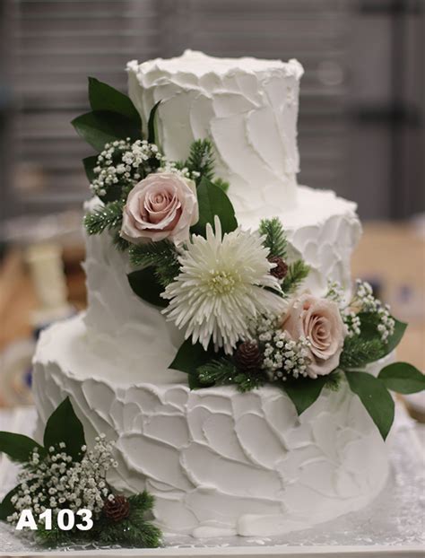 Rough Finish Buttercream Iced Wedding Cake With Fresh Flowers