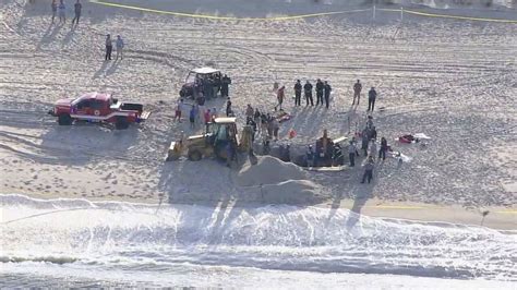 Officials Warn Bored Surfers Beachgoers About Dangers Of Digging Giant