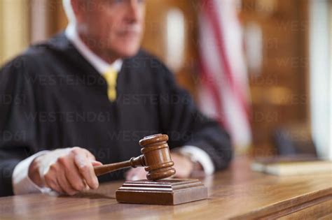 Judge Banging Gavel In Court Stock Photo