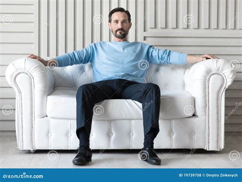 Confident Handsome Man Sitting On A Sofa Stock Photo Image Of Leisure
