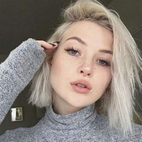 Video about young attractive female with blue eyes and blonde hair making selfie in park in front of trees and wooden bench on sunny summer day. Pin on Hair cut