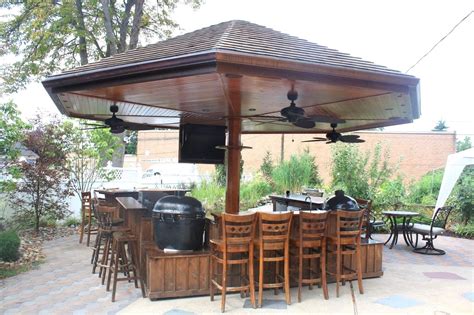 It includes a sink, bar and of course, a grill and fridge and it has a lovely pallet look . Outdoor bbq bar designs | Hawk Haven