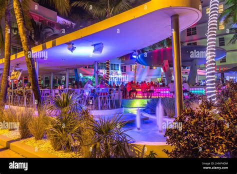people enjoy nightlife at Ocean Drive along South Beach Miami in the